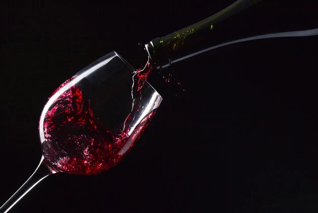 bottle and glass with red wine